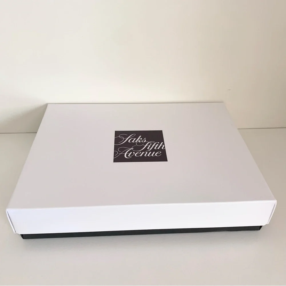 Hold Saks Fifth Avenue gift boxes